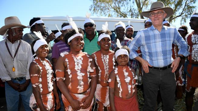 <s1>Prime Minister Malcolm Turnbull meets with a local indigenous dance troupe after arriving at Tennant Creek airport</s1> on Sunday. Picture: AAP/Dan Himbrechts