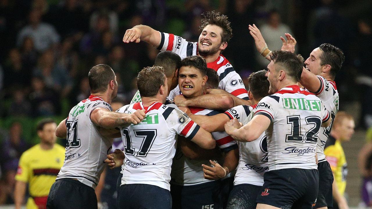 The Roosters celebrate Latrell Mitchell’s game winning field goal. 