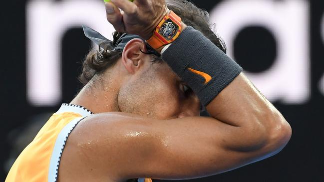 Rafael Nadal prepares to play a point in the 36C temperatures. Picture: Saeed Khan/AFP