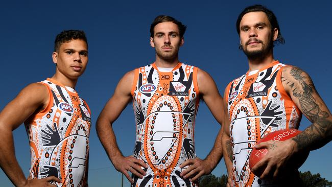 Giants players Ian “Bobby” Hill, Jeremy Finlayson and Zac Williams model the club’s indigenous jumper. Picture: AAP