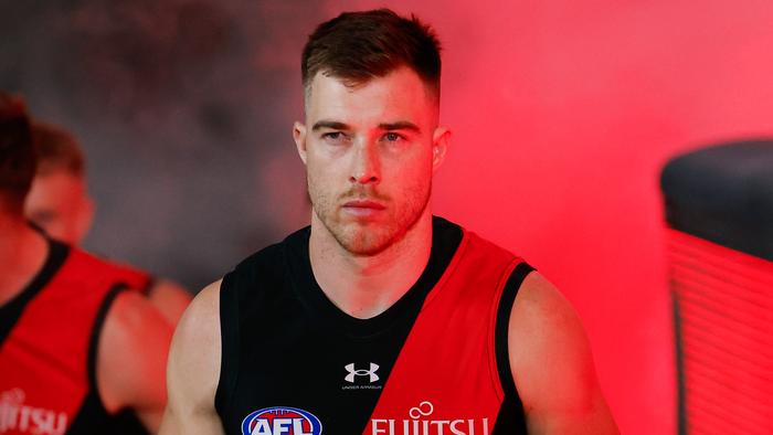 MELBOURNE, AUSTRALIA - AUG 16: Zach Merrett of the Bombers leads his team up the race during the 2024 AFL Round 23 match between Essendon Bombers and the Sydney Swans at Marvel Stadium on August 16, 2024 in Melbourne, Australia. (Photo by Dylan Burns/AFL Photos via Getty Images)