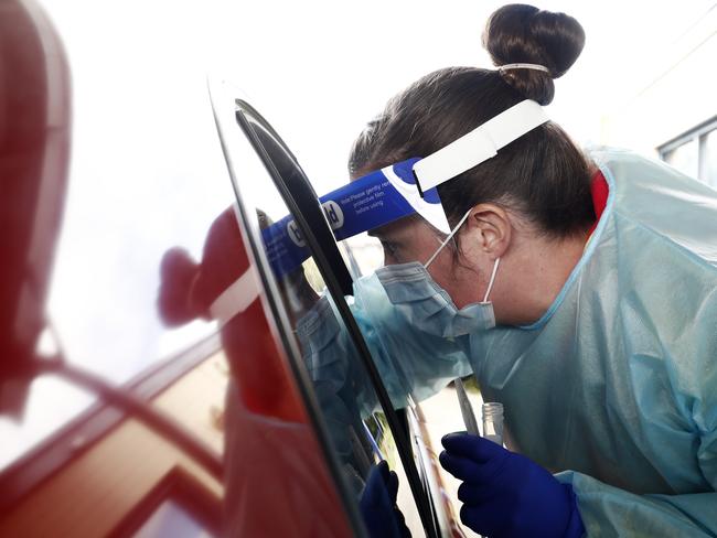 Medical professionals do COVID testing at a drive-through clinic. Picture: Getty Images