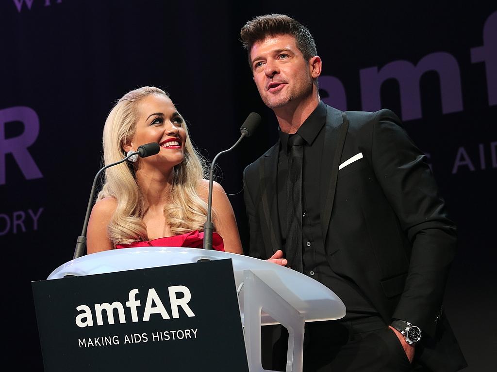 Rita Ora and Robin Thicke during amfAR’s 2015 Cinema Against AIDS Gala. Picture: Getty