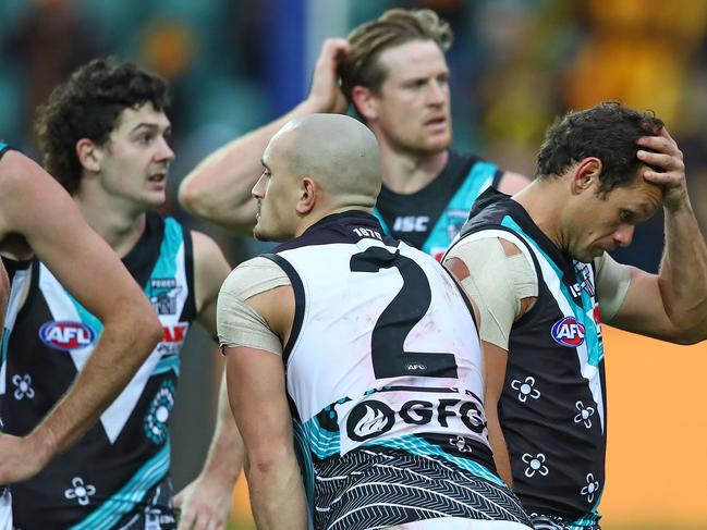 LAUNCESTON, AUSTRALIA - MAY 25: Steven Motlop of the Power and his teammates leave the field after losing the round 10 AFL match between the Hawthorn Hawks and the Port Adelaide Power at University of Tasmania Stadium on May 25, 2019 in Launceston, Australia. (Photo by Scott Barbour/Getty Images)