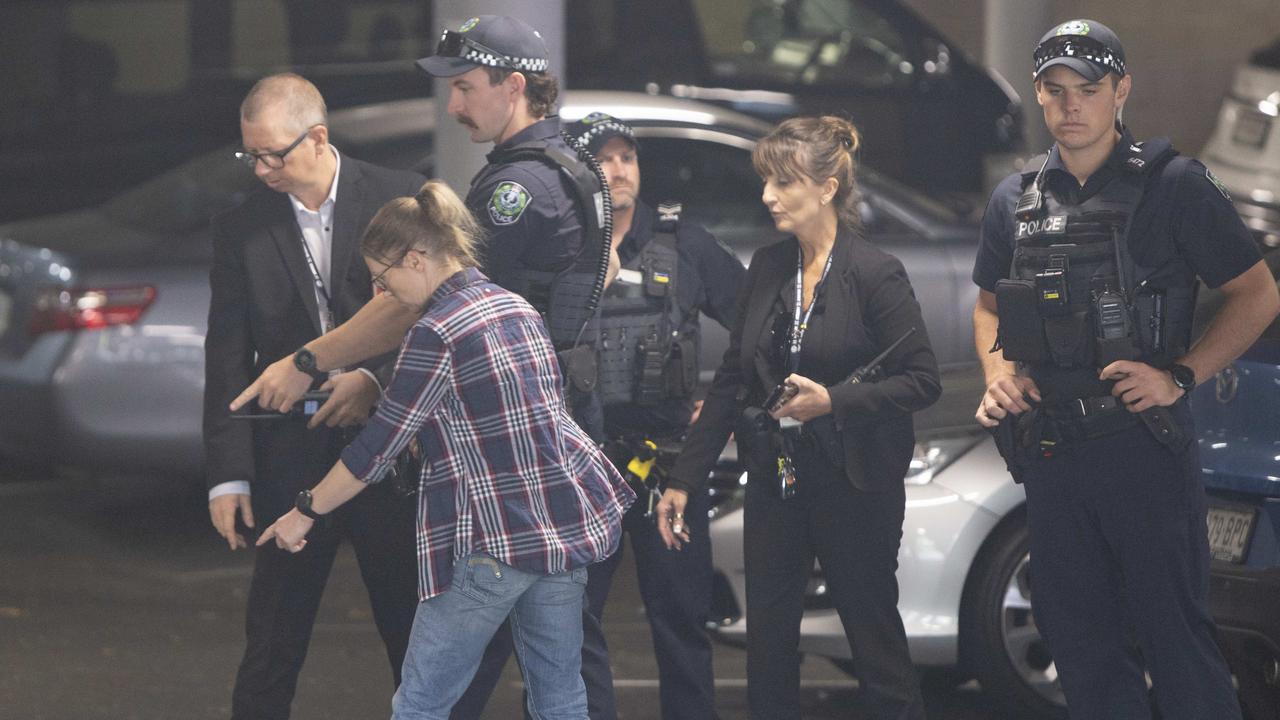 Police and detectives inside the carpark after the shooting. Picture: Brett Hartwig