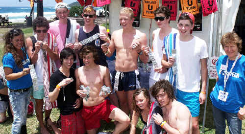 Schoolies pick up free condoms at the HUB on Main Beach at Byron Bay this week. . Picture: Dominic Feain