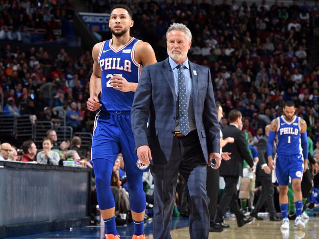 PHILADELPHIA, PA - MARCH 20: Ben Simmons #25 and Brett Brown of the Philadelphia 76ers look on during a game against the Boston Celtics on March 20, 2019 at the Wells Fargo Center in Philadelphia, Pennsylvania NOTE TO USER: User expressly acknowledges and agrees that, by downloading and/or using this Photograph, user is consenting to the terms and conditions of the Getty Images License Agreement. Mandatory Copyright Notice: Copyright 2019 NBAE (Photo by Jesse D. Garrabrant/NBAE via Getty Images)