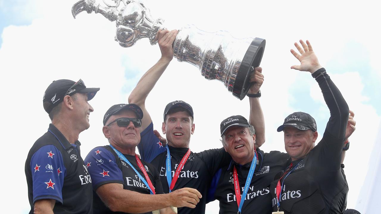 Chief Operating Officer Kevin Shoebridge, CEO Grant Dalton, helmsman Peter Burling, team principal Matteo de Nora and skipper Glenn Ashby lift the trophy as Emirates Team New Zealand win race 9 against Oracle Team USA to win the America's Cup on day 5 of the America's Cup Match Presented by Louis Vuitton on June 26, 2017 in Hamilton, Bermuda. (Photo by Clive Mason/Getty Images)
