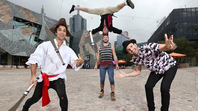 Head First acrobats Rown Thomas (left), Thomas Gorham and Cal Harris, pictured with magician James Galea (right) are all performing at the Melbourne International Comedy Festival. Picture: Ian Currie