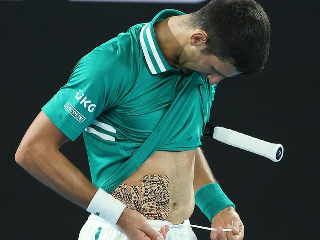 Djokovic’s abdomen was taped up.