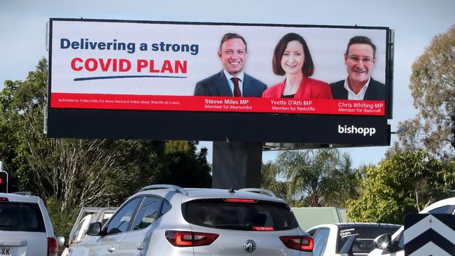 A billboard featuring Steven Miles, Yvette D’Ath and Chris Whiting.