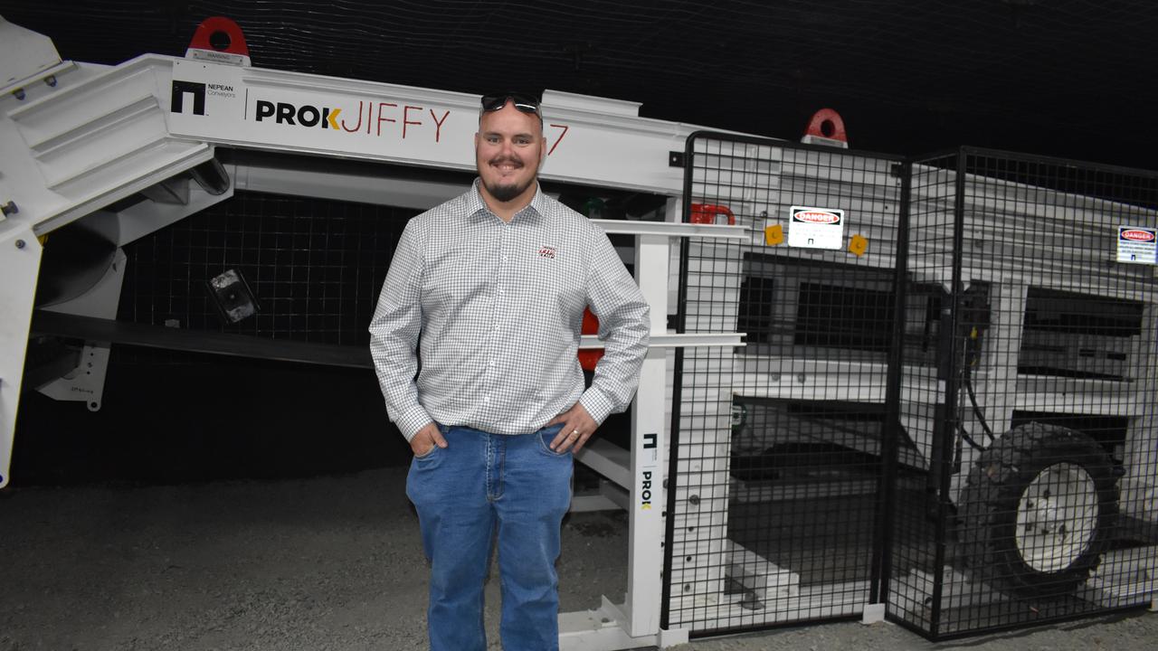 Rema Tip Top business development manager Dean Moffatt, standing with a display at the Resources Centre of Excellence open day. Rema Tip Top supplied a belt for the machine. Picture: Melanie Whiting