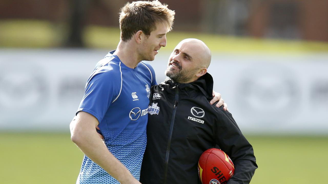 Sam Durdin chats with North Melbourne coach Rhyce Shaw at Arden St.