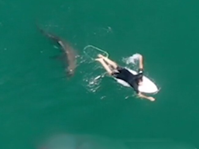 A NSW Surf Life Saving drone has helped save a pro surfer from a potential shark attack in a terrifying Mick Fanning-like encounter on a northern NSW beach., Byron Bay-based world championship tour competitor Matt Wilkinson was surfing Sharpes Beach at Ballina on Wednesday when the lifesaving drone alerted him to a 1.5m shark which had surfaced just behind him., Amazing footage of the close call has been released by Surf Life Saving NSW, which operates the drone service to monitor beaches in the Ballina area