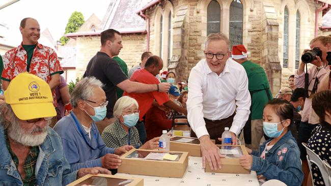 Anthony Albanese, serving lunch on Christmas Day at the Bill Crews Foundation, in Ashfield. Picture: Justin Lloyd.