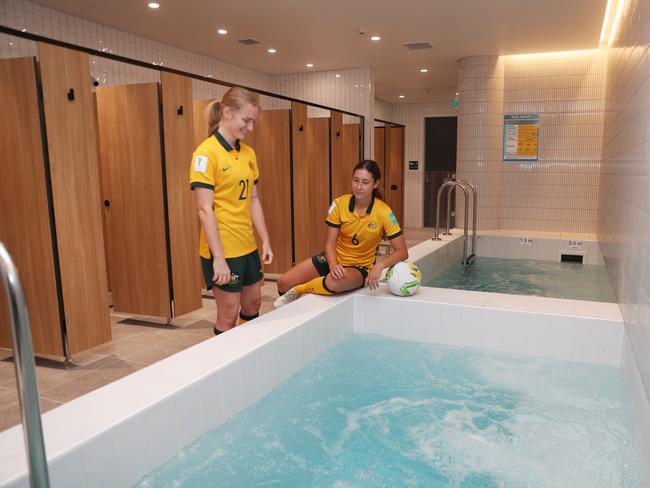 Daily Telegraph March 22/3/23. The new redeveloped gender neutral change rooms at Accor Stadium Homebush. Matilda Future under 20s World Cup players , blonde, Sarah Hunter and Abbey Lemon check out the new change rooms. picture John Grainger