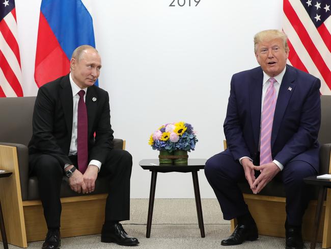 Vladimir Putin and Donald Trump met on Friday, with the US President joking that his Russian counterpart should not meddle in the election. Picture: Mikhail Klimentyev / Sputnik / AFP.