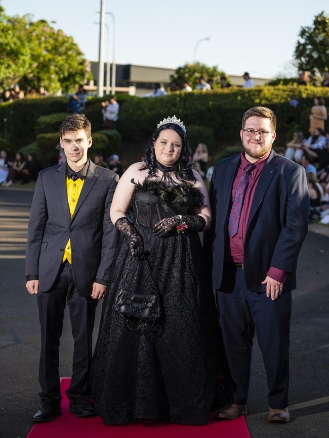 Arriving at Harristown State High School formal are (from left) Thomas McRae, Katiqua Rubesaame and Brayden Collins at Highfields Cultural Centre, Friday, November 18, 2022. Picture: Kevin Farmer