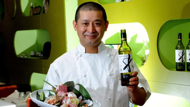 Kenji chef/owner Kenji Ito with one of his seafood creations.