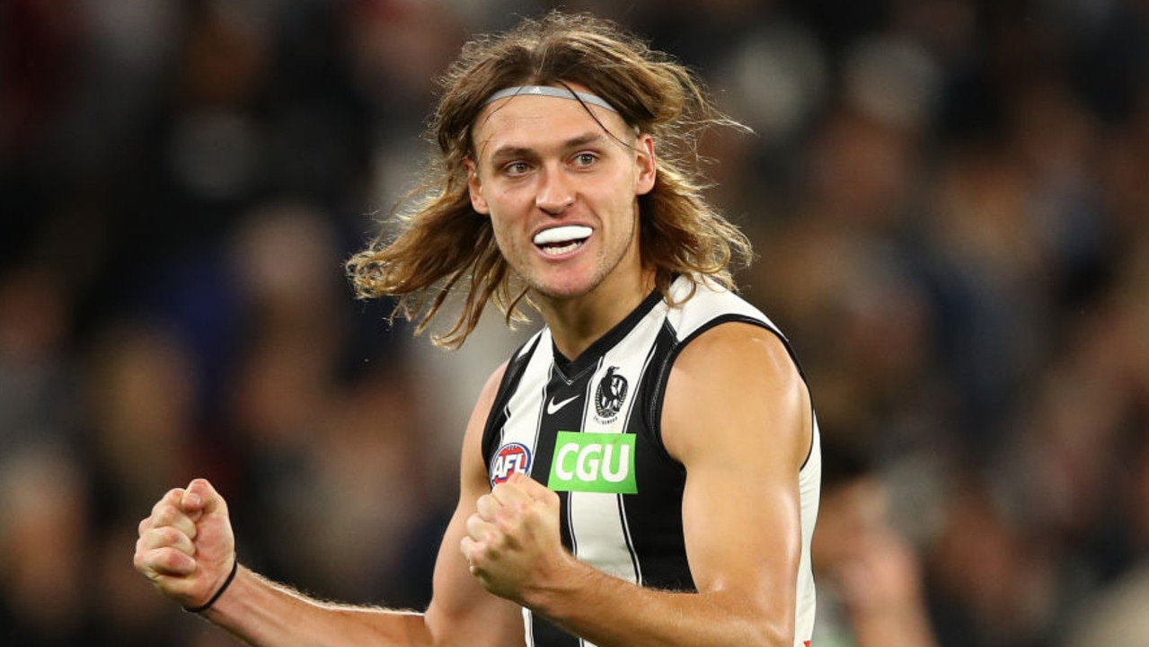 MELBOURNE, AUSTRALIA - MARCH 25: Darcy Moore of the Magpies celebrates after the Magpies defeated the Blues during the round 2 AFL match between the Carlton Blues and the Collingwood Magpies at the Melbourne Cricket Ground on March 25, 2021 in Melbourne, Australia. (Photo by Robert Cianflone/Getty Images)