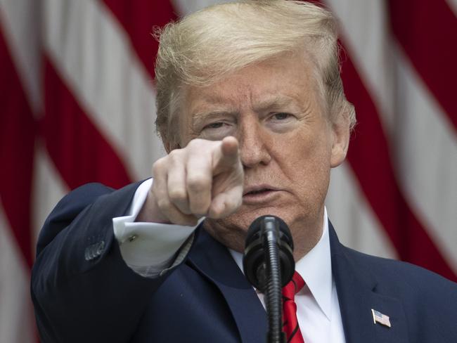 In this May 11, 2020 photo, President Donald Trump points to a question as he speaks about the coronavirus during a press briefing in the Rose Garden of the White House in Washington. Trump has many targets in his war against the media but perhaps none more surprising than the Voice of America, the venerable U.S.-government funded institution created during WWII and expanded during the Cold War to broadcast independent news and promote democracy and American values to the world. In a series of attacks, Trump and his supporters have accused the outlet of â€œdisgracefulâ€ reporting. They're now pushing hard to install their choice to run the agency that oversees VOA and its affiliates. That battle is about to hit Congress, where partisan lines have already been drawn over fears the administration wants to turn them into Trump propaganda machines. (AP Photo/Alex Brandon)