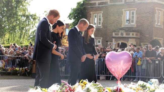 Catherine, Princess of Wales, Prince William, Prince of Wales, Harry and Meghan view flowers and tributes on the long Walk at Windsor Castle. Picture: Getty Images.