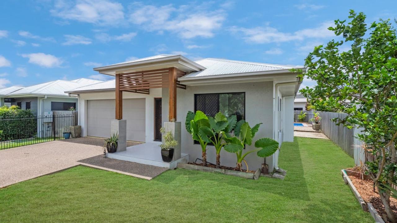 This four-bedroom house at 52 Bluewattle Blvd, Rasmussen, Townsville, is on the market for offers over $559,000.