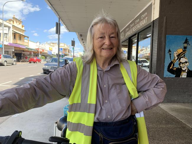 Lynette Spence cares about the environment, riding an electric bike to get to where she’s going.