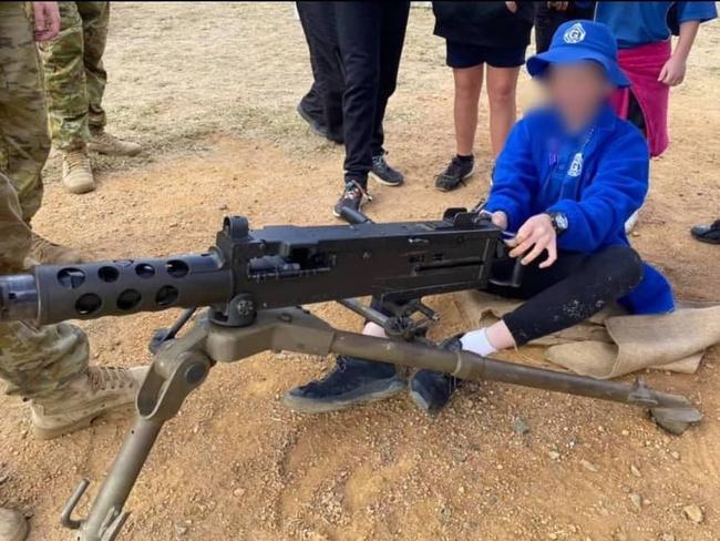 Children as young as six play with heavy weapons as part of ADF community engagement in Gayndah. Photo/Twitter.