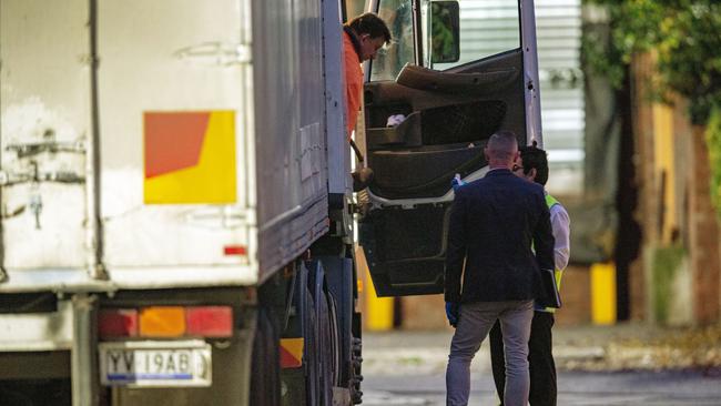 A truck driver arriving at Cedar Meats has his temperature taken. Picture Getty Images.