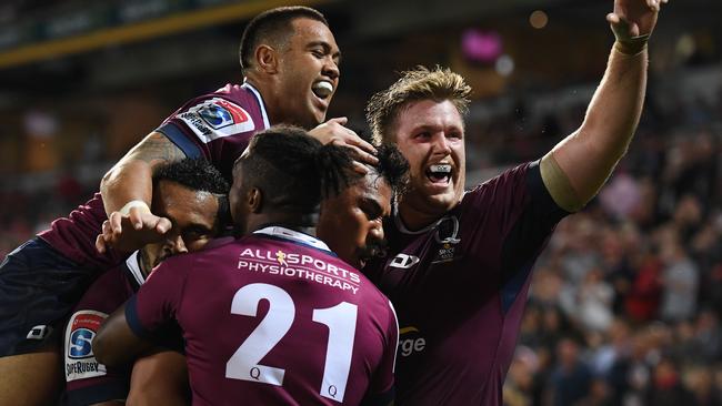 Reds players celebrate a try to Alex Mafi. Picture: AAP