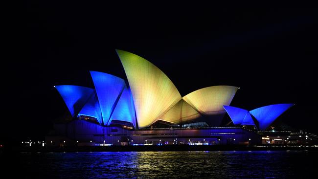 It’s not the first time that the Opera House has been lit up in the colours of another country, with blue and yellow displayed on the sails after Russia began its war against Ukraine. (Photo by James D. Morgan/Getty Images)