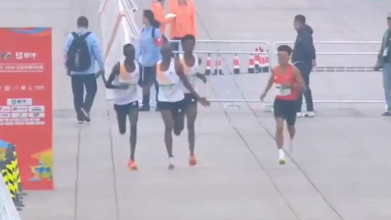 The East African runners appeared to wave a Chinese athlete ahead of them, allowing him to win first place.