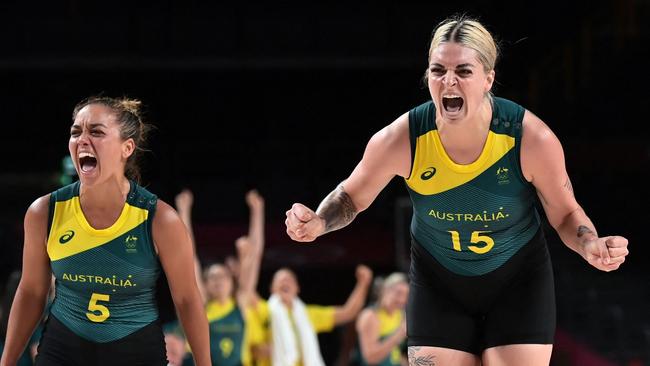 Australia's Leilani Mitchell and Cayla George celebrate their victory over Puerto Rico. Picture: AFP