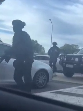 A screenshot of a video showing police storming Westfield Marion on Sunday.