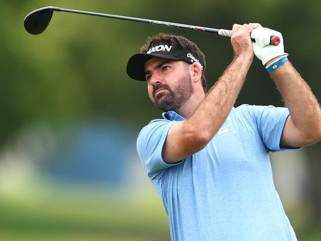 BRISBANE, AUSTRALIA - NOVEMBER 21: Brett Drewitt of Australia  plays his second shot on the seventh hole on day one of the BMW Australian PGA Championship 2024 at Royal Queensland Golf Club on November 21, 2024 in Brisbane, Australia. (Photo by Chris Hyde/Getty Images)