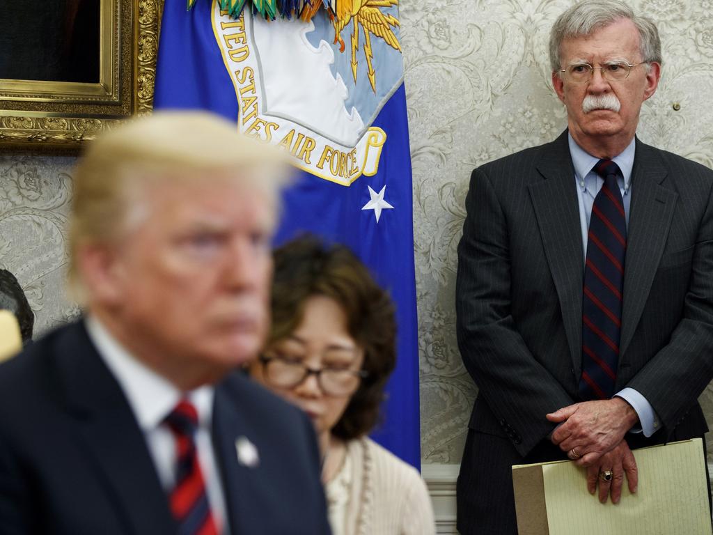 US President Donald Trump, left, has fired national security adviser John Bolton, right, who will be the 47th Trump staffer to be ousted during the administration. Picture: AP