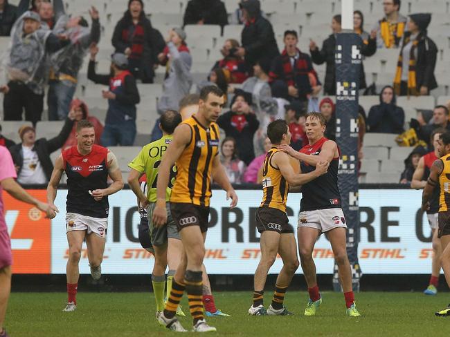 Kade Stewart wrestles with Bernie Vince after kicking a behind from the free kick. Picture: Wayne Ludbey