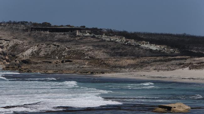 The state’s most prestigious tourism resort has been reduced to twisted sheets of charred corrugated iron. Picture: Emma Brasier