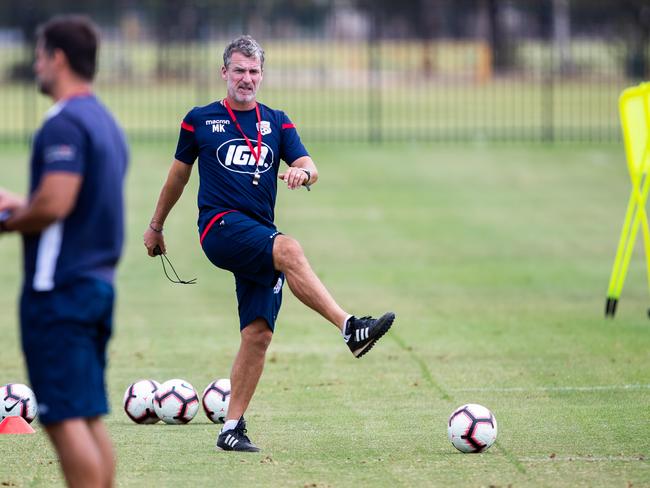 Coach Marco Kurz kicks the ball during an Adelaide United training session in Adelaide, Tuesday, February 19, 2019. (AAP Image/James Elsby) NO ARCHIVING