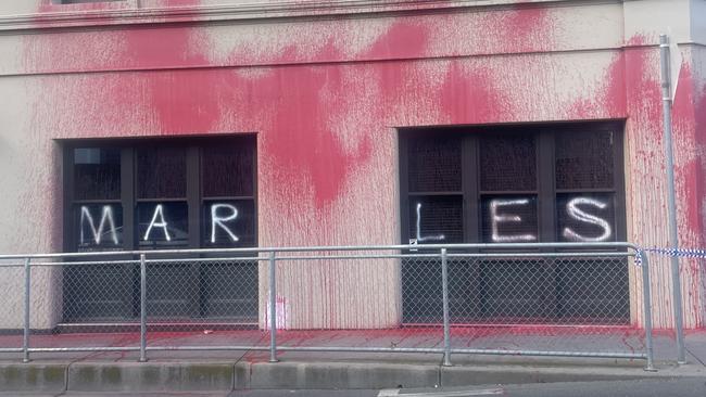 The building was splattered with red paint and covered with confronting messages directed at Mr Marles.