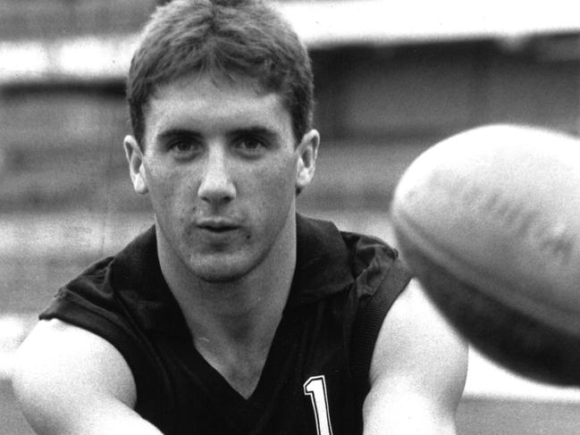 19 May 1989. Carlton, desperate to keep its 1989 finals hopes alive, has an 18-year-old rookie on "standby" for today's clash against arch-enemy Collingwood.Peter White, recruited from Swan Hill, was officially registered with the VFL yesterday and included on Carlton's list in place of the retired Bernie Evans.White, who does not turn 19 until July 11, is one of three emergencies named by the Blues on Thursday night after outstanding form with the reserves in the past two weeks.His only senior experience this season has been in Carlton's Panasonic Cup win against North Melbourne.A rover-half forward, White (177 cm and 75 kg) also went overseas with the Blues at the end of last season and played against Hawthorn's John Platten in London.White's registration last night fuelled speculation that champion centreman Craig Bradley might be a late withdrawal from today's big game at VFL Park.Bradley has been having daily physiotherapy treatment for a calf injury and did not train on Thursday night.It is understood the injury is responding to treatment and that he rates his fitness about 80 per cent.Carlton coach Robert Walls last night refuted a suggestion that Bradley would withdraw."All I can tell you is that we will line up as selected," Walls said emphatically. "Bradley will play." Collingwood also could make a last-minute change if full-back Ron McKeown fails a fitness test this morning.McKeown withdrew from last Saturday's match against Footscray and was still showing the effects of a thigh injury at training on Thursday.The Magpies have taken "insurance" against McKeown by naming Brett Gloury as one of three emergencies.Gloury, 20, who is 193 cm and 86 kg, plays at full-back, although his first senior appearance in that role in 1986 was one he would rather forget - Essendon's Paul Salmon kicked seven goals on him.Although Carlton - with only one victory after seven rounds - must win today to keep its hopes alive, Walls last night maintained his low-key approach.Asked if today's game was the most crucial so far this season, he replied: "Not really."PICTURED: The new Blue . . . Peter White was registered with the VFL yesterday and could be a surprise inclusion today for the match of the day against Collingwood.(The Sun 20/05/1989, p96)