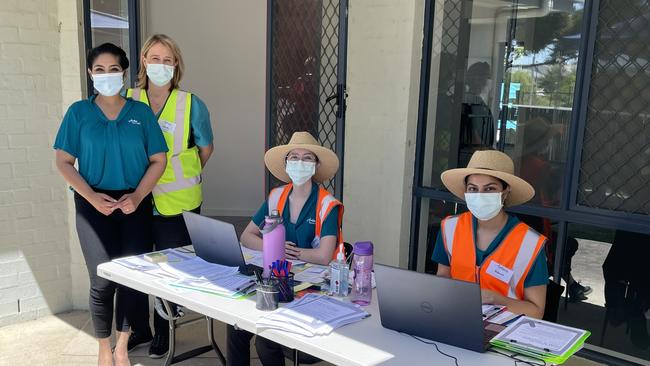 Staff at a pop-up Pfizer clinic set up in Pimpama by Dr Tanya Unni (left) from Amtan Medical.