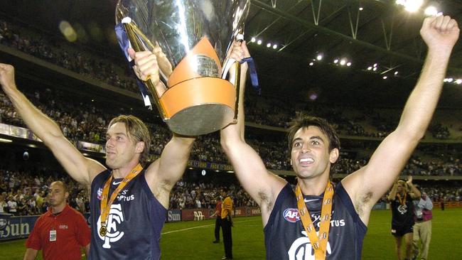 Anthony Koutoufides and Scott Camporeale celebrate the Blues' victory in the 2005 Wizard Cup Grand Final at Telstra Dome in 2005.