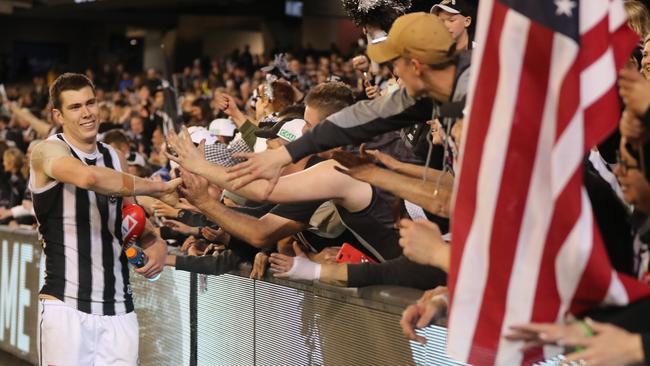 Mason Cox celebrates with fans after qualifying for the Grand Final. Picture: Alex Coppel