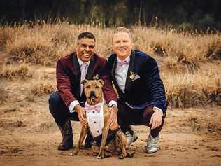 LOVE IS LOVE: Malcome Mitchell and husband Ian McDonald with their dog, Kronk, at their wedding in Mitchell on Saturday. Picture: KATRINA AYERS