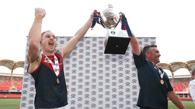 Surfers Paradise captain Brody Haberfield (left) and coach Brad Moore (right) celebrate their 2019 premiership. Pic: AFLQ