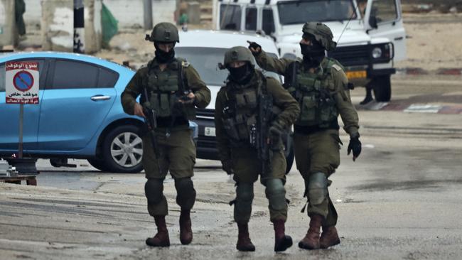 Israeli soldiers patrol Huwara following the shooting on Sunday. Picture: AFP