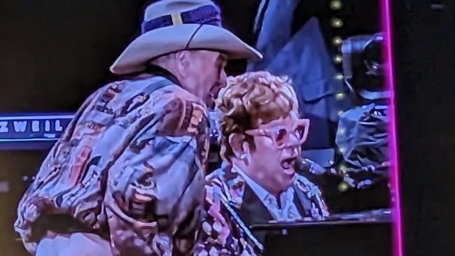 Molly Meldrum drops his pants on stage at an Elton John concert.