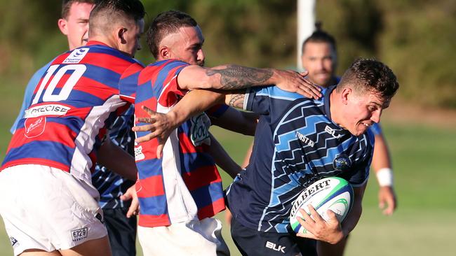 Jones (right) in action for his Helensvale Hogs club team. Picture: Richard Gosling